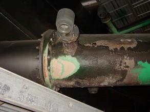 Severely damaged FRP pipe caused by lime slurry