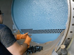 Composite Industrial Inc. applying a protective coating to a heat exchanger